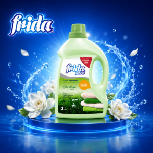 Green Frida Fabric liquid detergent bottle on a glowing blue stage with water splash and white flowers in the foreground.