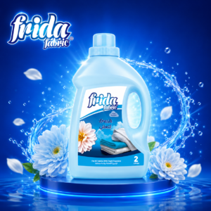 Blue Frida Fabric laundry detergent bottle labeled 'Fresh', 2 litres, with blue floral backdrop and water splash around it.